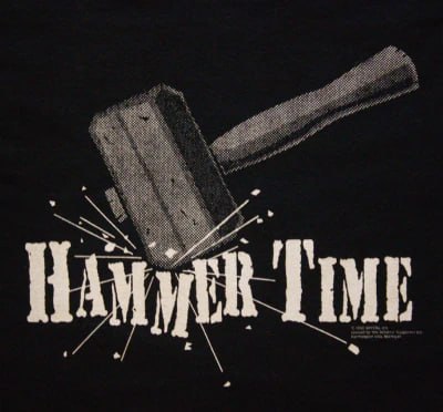A hammer striking with explosive impact, illustrating the one-tool coaching problem